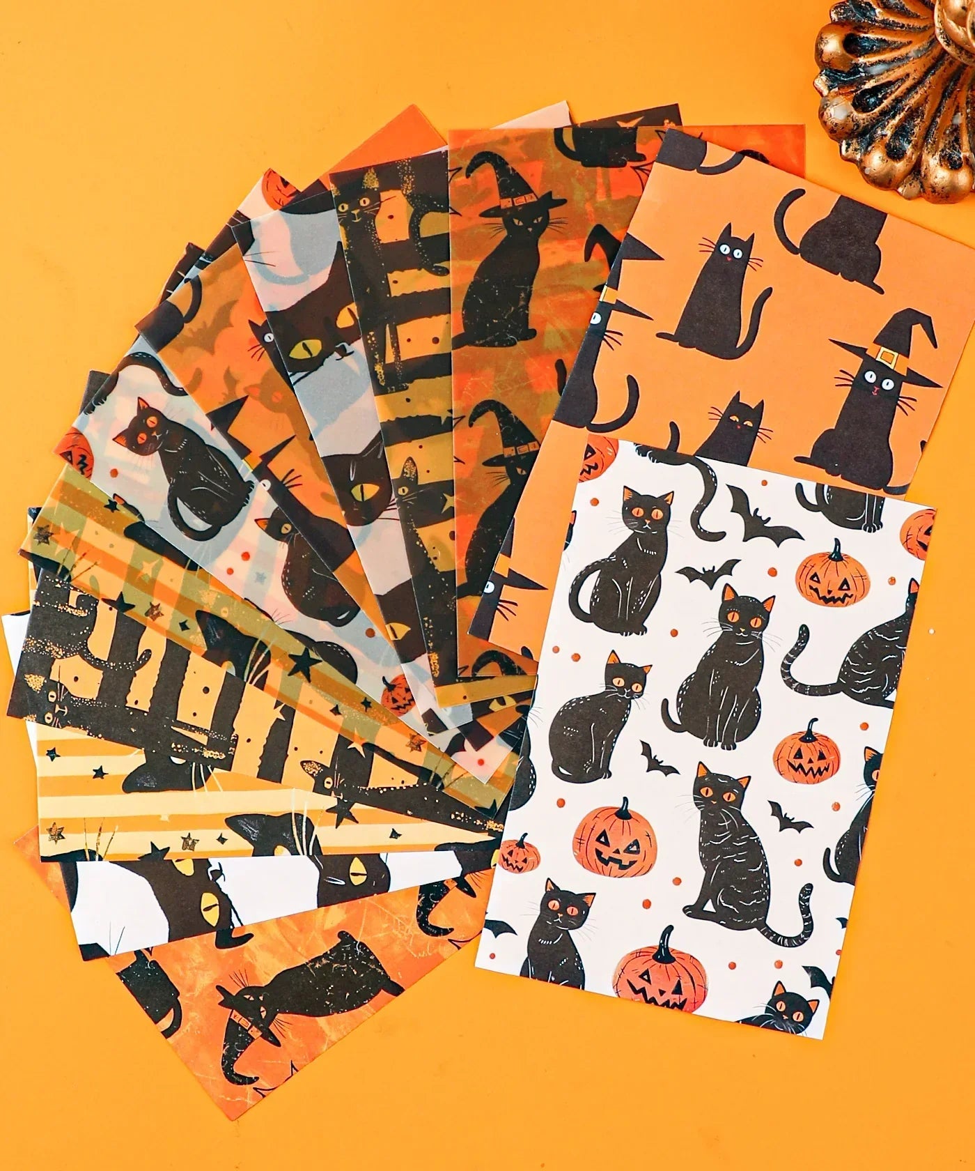Halloween-Themed Grabie Scrapbook Club Box featuring patterned papers with black cats, pumpkins, bats, and Halloween motifs