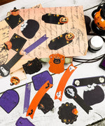 22 Pcs Grabie Exclusive Happy Haunting Sticker Set with Halloween-themed labels and decorative tags in black, orange, and purple colors.