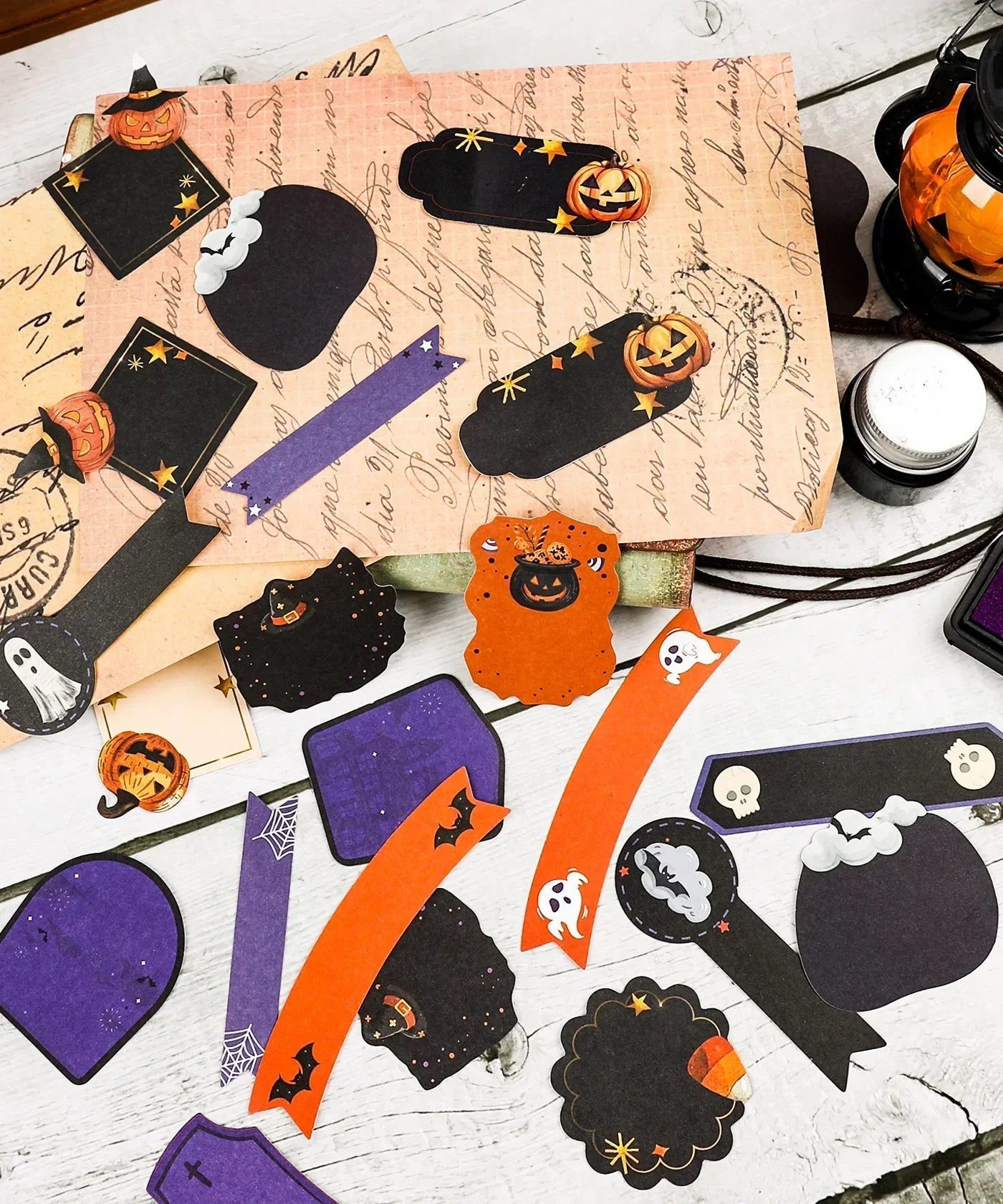 22 Pcs Grabie Exclusive Happy Haunting Sticker Set with Halloween-themed labels and decorative tags in black, orange, and purple colors.