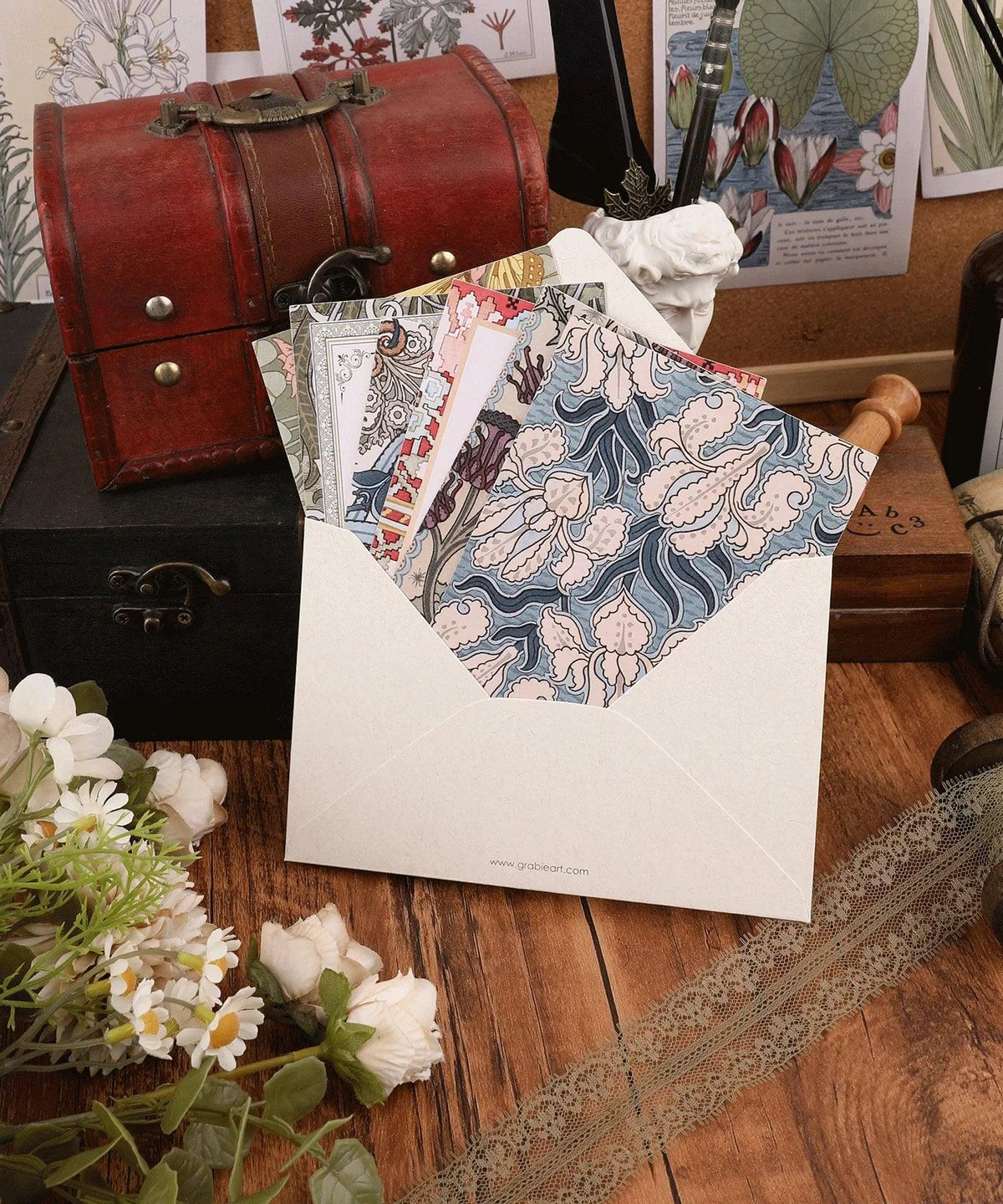 6 Pack Postcards With 6 Matching Envelopes featuring floral patterns displayed on a wooden table with vintage decor.