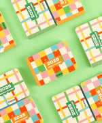 Colorful 2-IN-1 2025 Monthly & Weekly Planner with a bright checkered design on a light green background