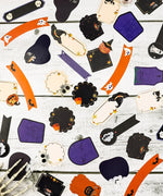 22 Pcs Grabie Exclusive Happy Haunting Sticker Set with Halloween-themed shapes on a wooden surface for scrapbooking