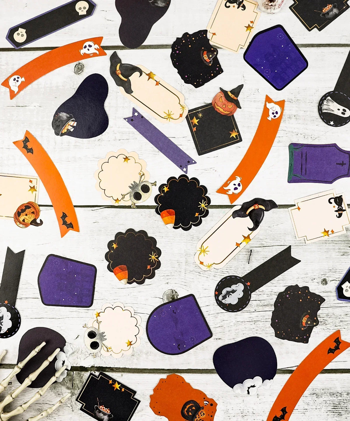 22 Pcs Grabie Exclusive Happy Haunting Sticker Set with Halloween-themed shapes on a wooden surface for scrapbooking