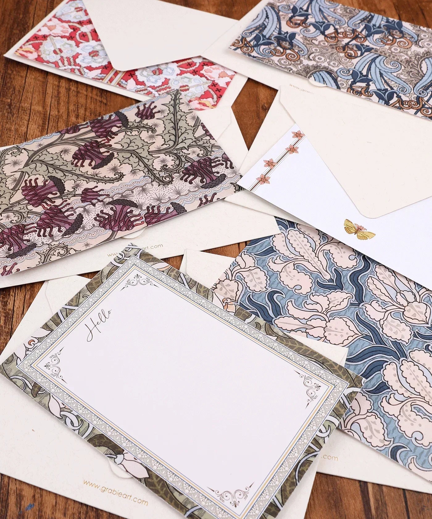 6 Pack Postcards With 6 Matching Envelopes featuring intricate floral and abstract designs on wooden background
