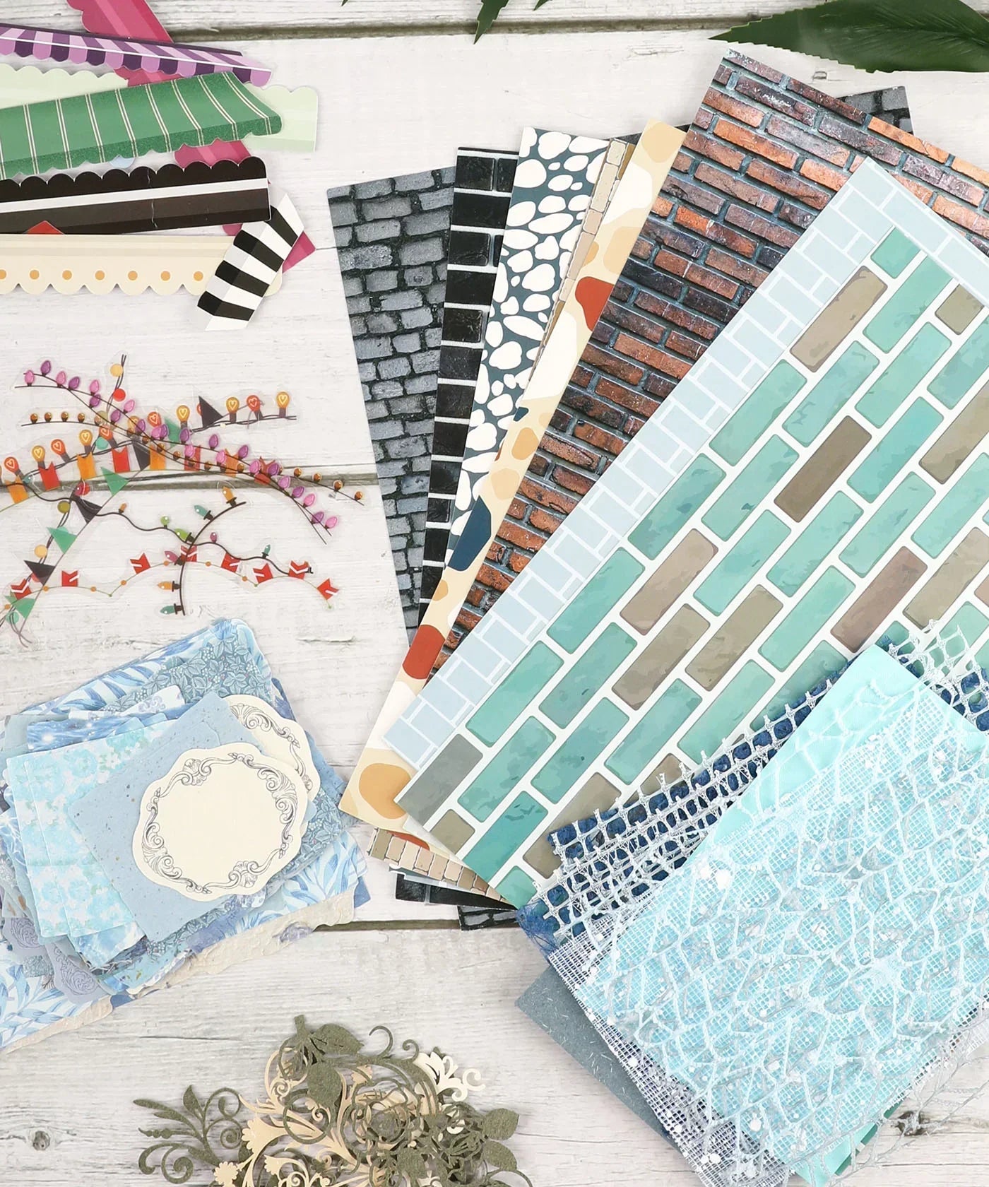 Cozy Pop Stores-Themed Grabie Scrapbook Club Box with patterned papers, decorative cutouts, and crafting supplies for scrapbooking.
