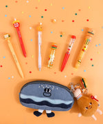 Colorful pens and pencil case with playful food-themed charms from Mouthwatering Foodie Stationery Set Of 9