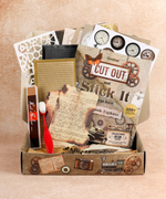 Steampunk Explorer-Themed Grabie Scrapbook Club Box with vintage paper, stencils, and art supplies for scrapbooking projects
