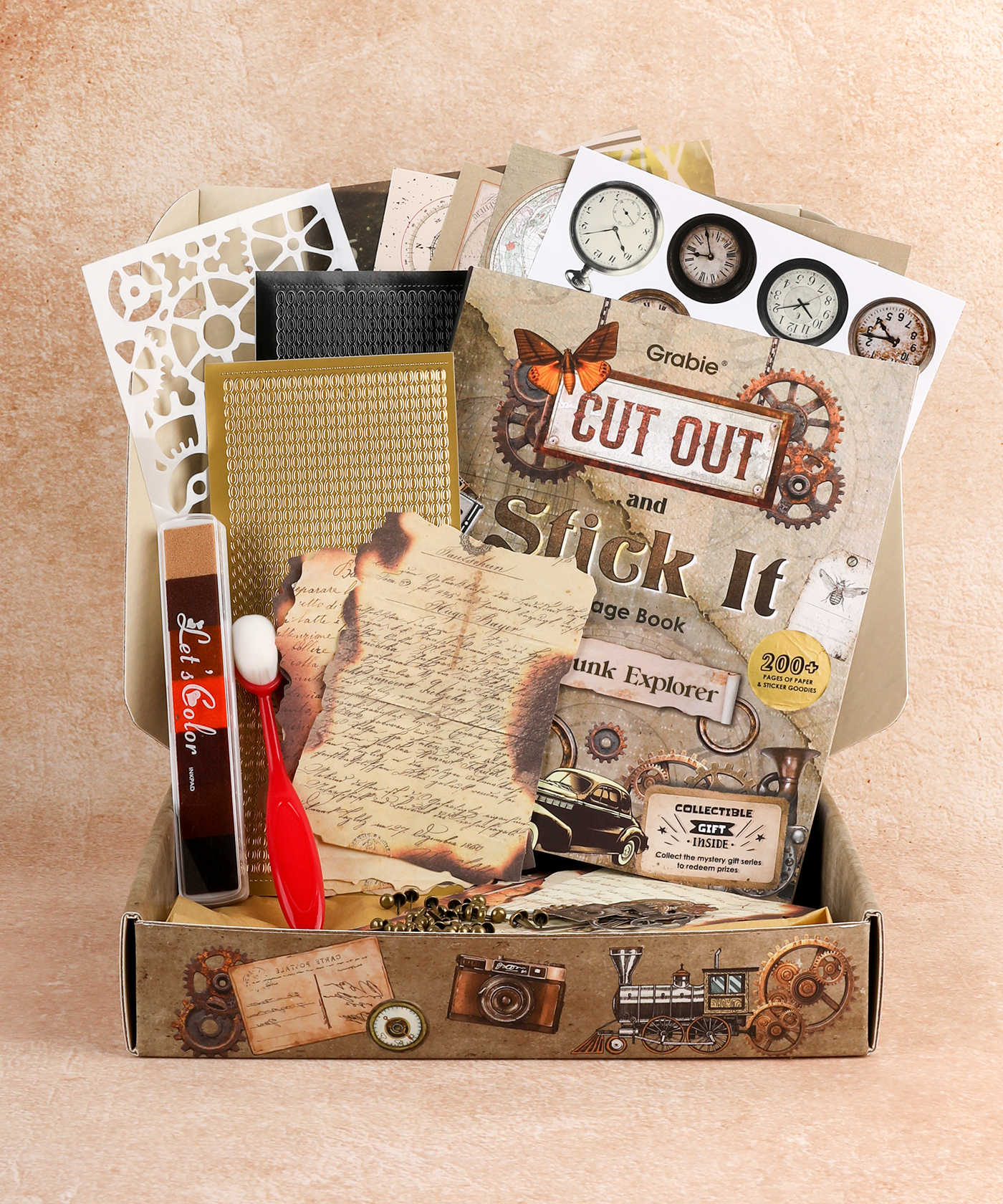 Steampunk Explorer-Themed Grabie Scrapbook Club Box with vintage paper, stencils, and art supplies for scrapbooking projects