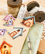 20 Pcs Grabie Exclusive Fairybird House Sticker Set with colorful birdhouse designs on a notebook and craft supplies.