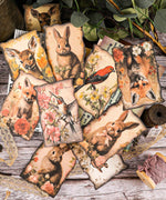 20 Sheets Grabie Exclusive Silent Woodland Paper Set with vintage-style animal and floral illustrations for scrapbooking and art projects