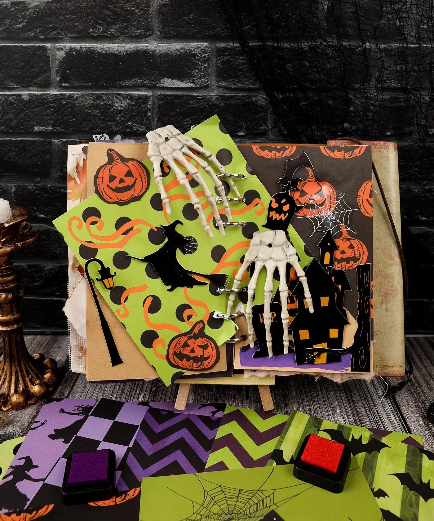 16 Sheets Grabie Exclusive Halloween Party Paper Set with spooky pumpkins, witches, skeleton hands, and haunted house designs