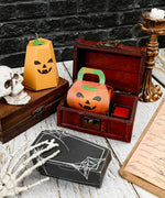 3 Sheets Grabie Exclusive Halloween DIY Kit with paper pumpkin crafts, wooden chest, and spooky decor on white wood table