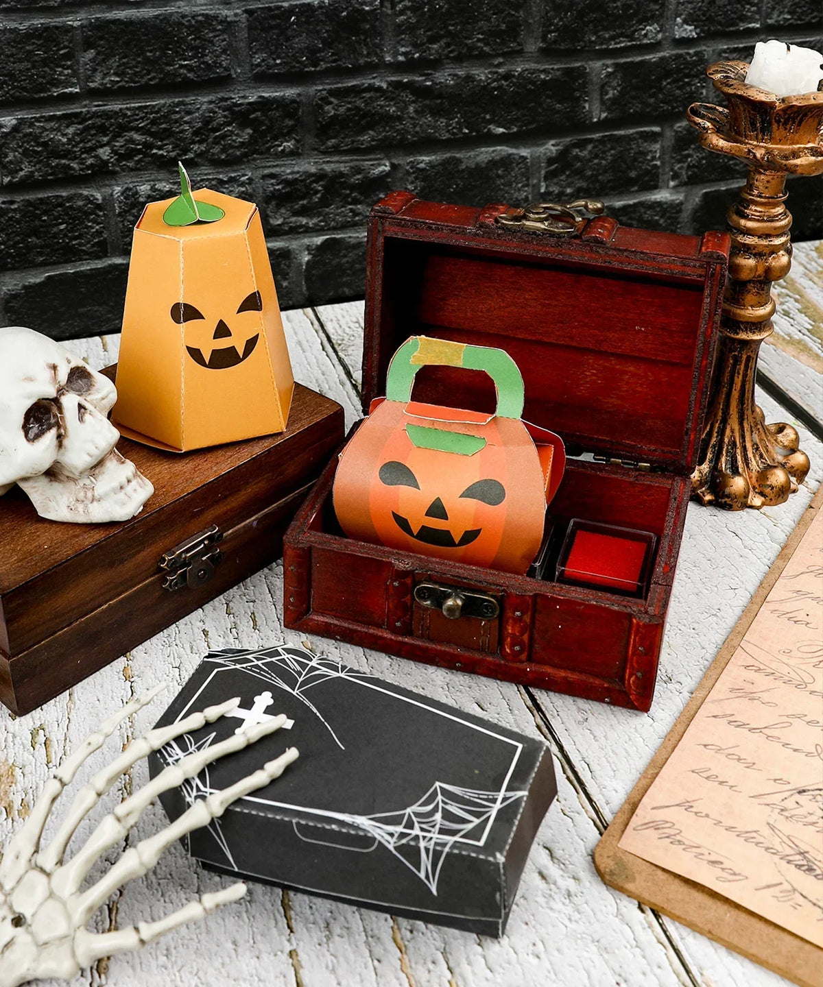 3 Sheets Grabie Exclusive Halloween DIY Kit with paper pumpkin crafts, wooden chest, and spooky decor on white wood table