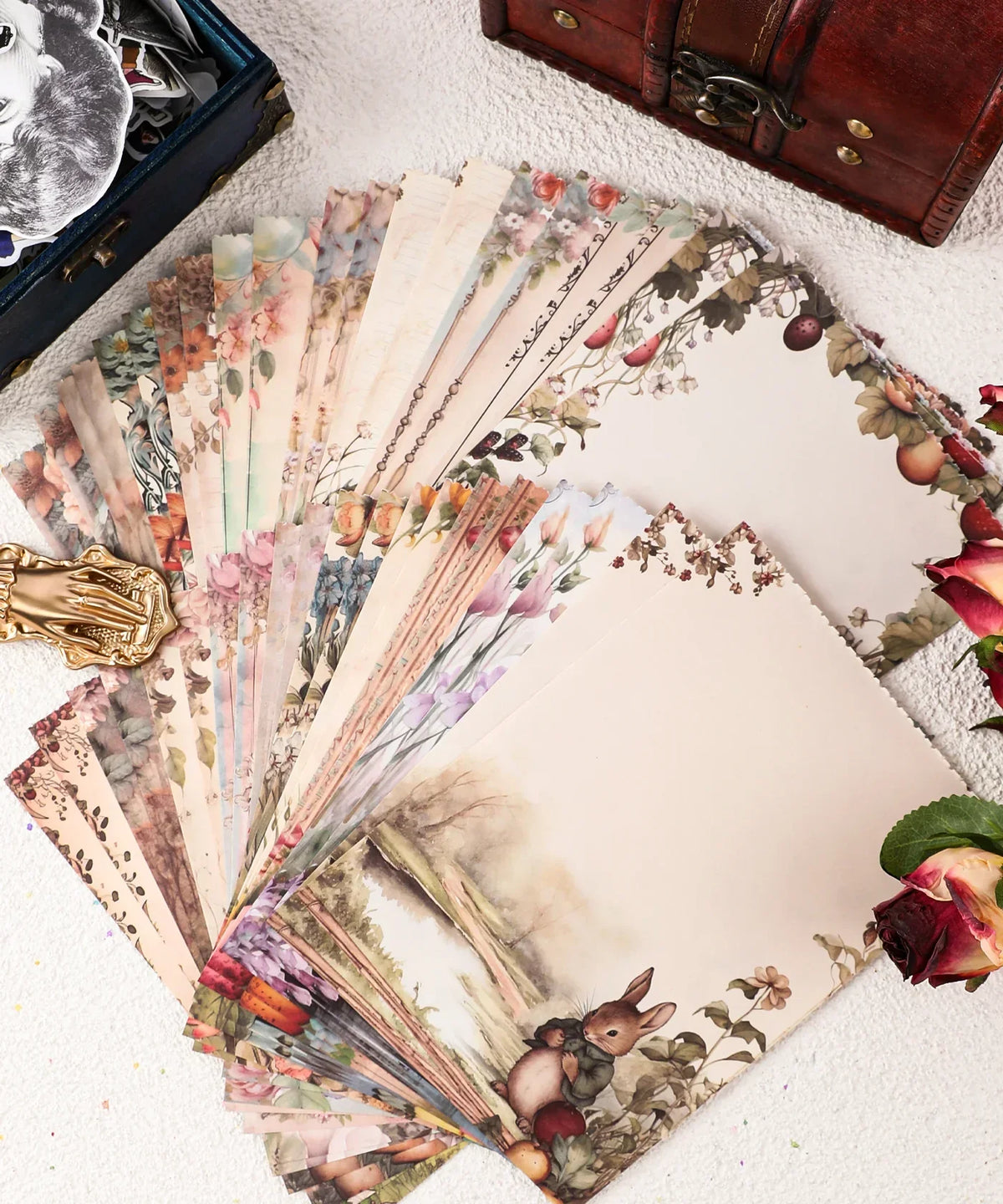 Grabie Exclusive Desktop Notepad Jotter with vintage floral and animal-themed writing paper spread on a table.