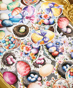 Assorted colorful Easter eggs, nests, flowers, and bows from the 52 Pcs Grabie Exclusive Hoppy Easter Sticker Set