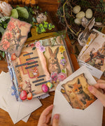 Creative Easter scrapbook pages and vintage animal postcards in Easter-Themed Grabie Scrapbook Club Box with art supplies and decorations