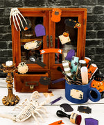Decorative Halloween stickers on wood cabinet with spooky art supplies in cozy craft setting featuring 22 Pcs Grabie Exclusive Happy Haunting Sticker Set