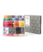 Extra Fine Tip Acrylic Paint Marker Set of 48 with vibrant colors arranged next to a patterned drawing pad for creative use