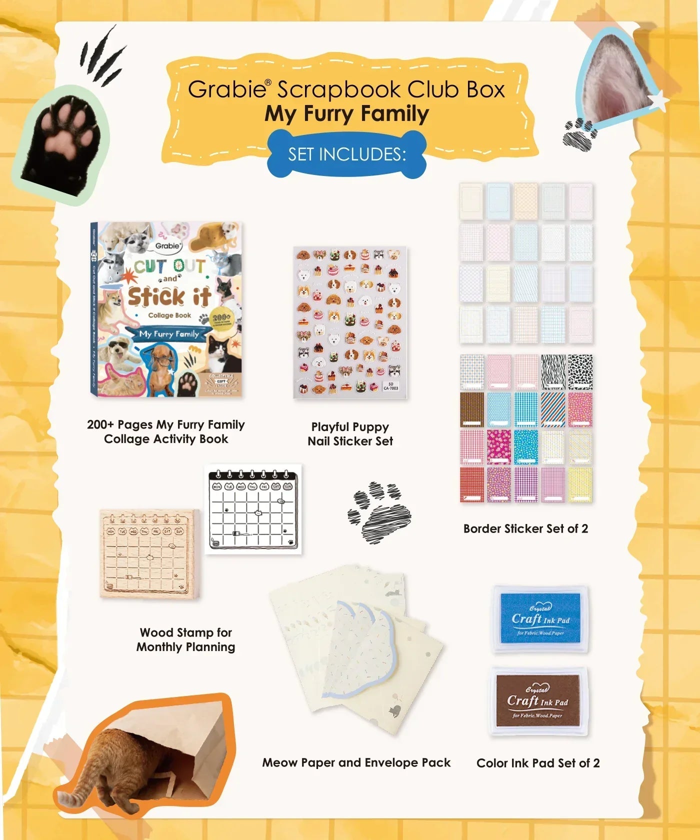 Contents of My Furry Family-Themed Grabie Scrapbook Club Box including stickers, stamps, paper, and ink pads for scrapbooking.