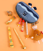 Mouthwatering Foodie Stationery Set Of 9 with colorful pens, markers, and food-themed pencil case on orange background