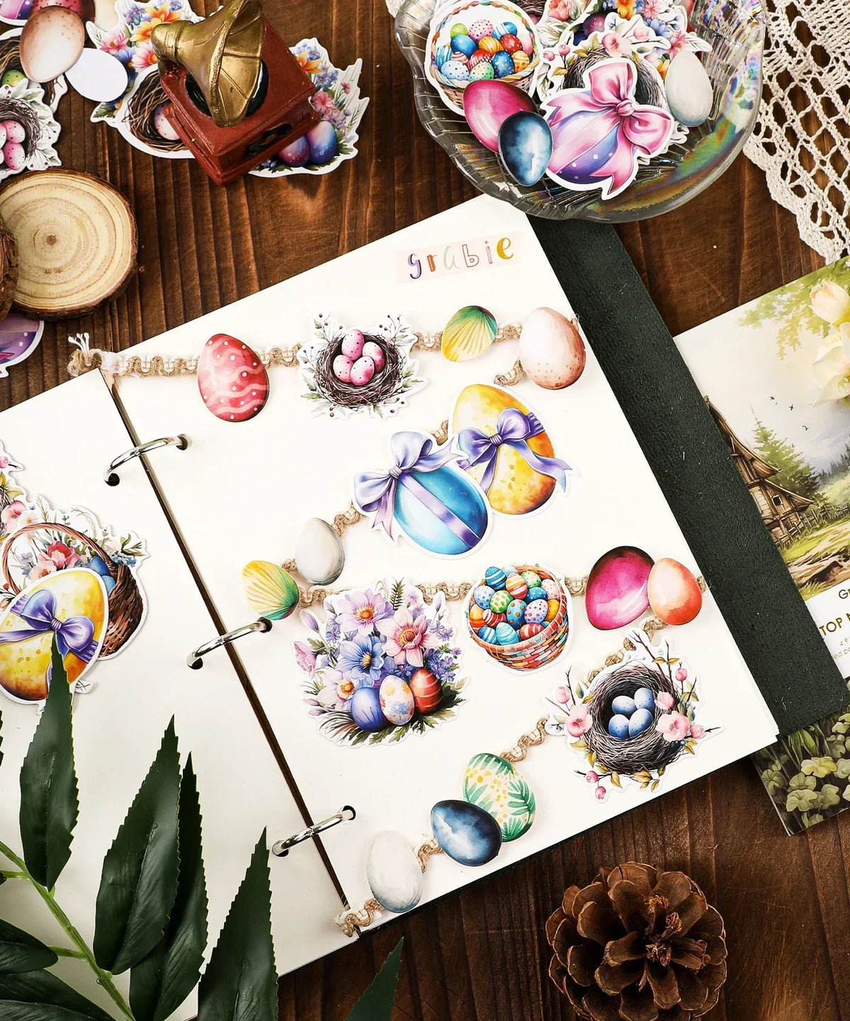 Open scrapbook featuring colorful Easter-themed stickers from the 52 Pcs Grabie Exclusive Hoppy Easter Sticker Set