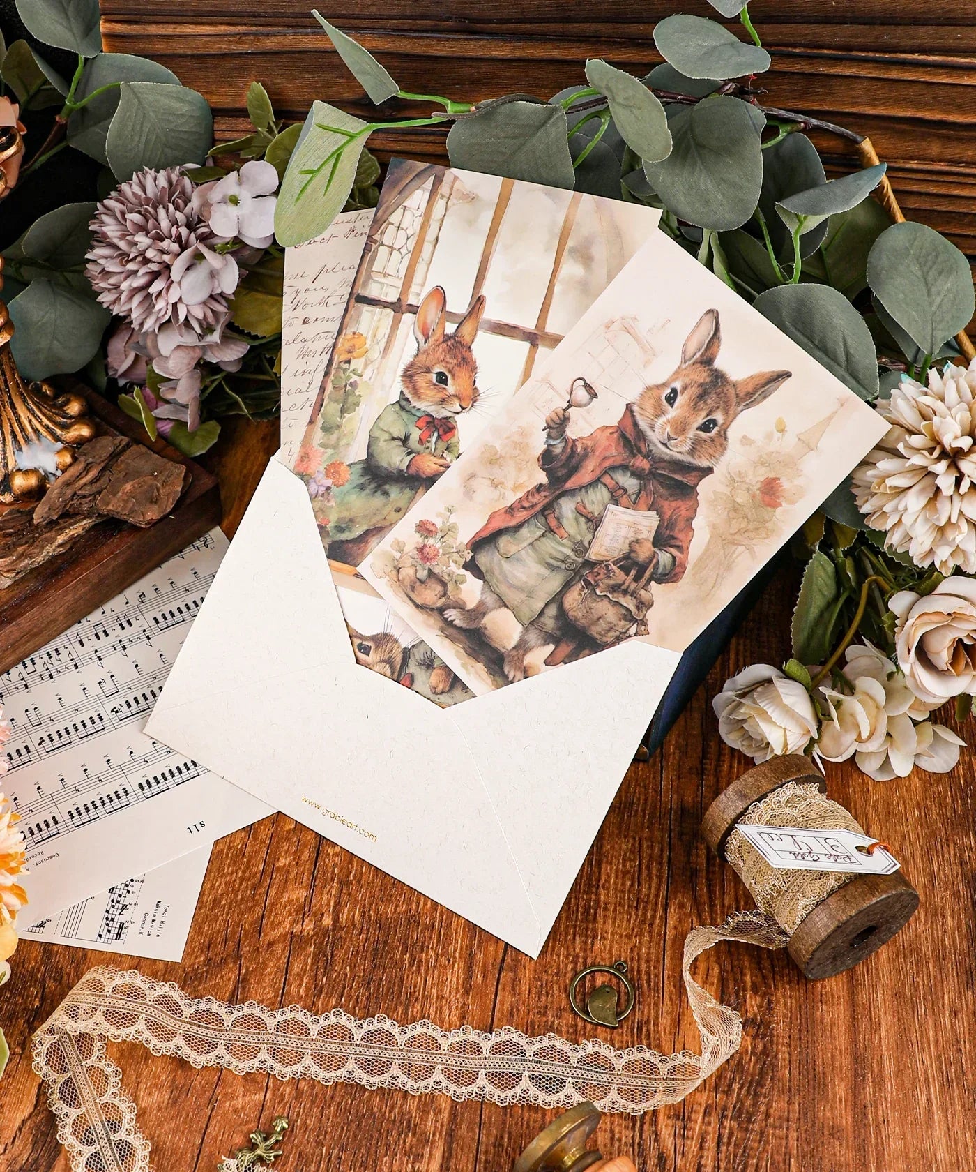 Grabie Exclusive 6 Pack Postcards With 6 Matching Envelopes featuring vintage rabbit illustrations on a wooden table.