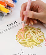 Close-up of hand coloring an abstract design with pink marker on Day 23 page of Let Your Feelings Flow 30-Day Workbook