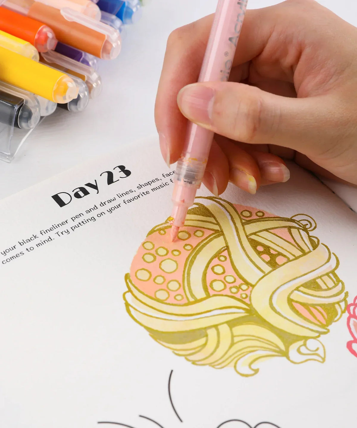 Close-up of hand coloring an abstract design with pink marker on Day 23 page of Let Your Feelings Flow 30-Day Workbook