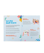 Open pages of Be You And Love You 28-day Workbook showing self-care art ideas and colorful illustrations.