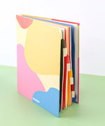 Grabie Sort It Out Accordion File Folder with colorful expandable sections for organizing art supplies and craft materials.