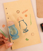Happy Halloween Clear Photopolymer Stamps used to decorate scrapbook paper with colorful Halloween-themed designs.