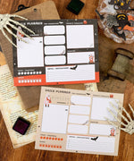 30 sheets Halloween Exclusive Daily Planner with spooky designs and sections for priorities, notes, and hydration tracking