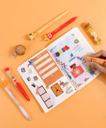 Mouthwatering Foodie Stationery Set Of 9 with vibrant pens and doodles decorating a colorful planner spread.