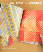 200+ Pages Threads of Time Collage Activity Book open to colorful patterned tear-out sheets for scrapbooking and crafts