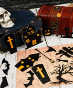 Halloween-themed black and orange paper stickers with haunted houses, coffins, trees, bats, and pumpkins from the 50 Pcs Grabie Exclusive Such a Fright Sticker Set