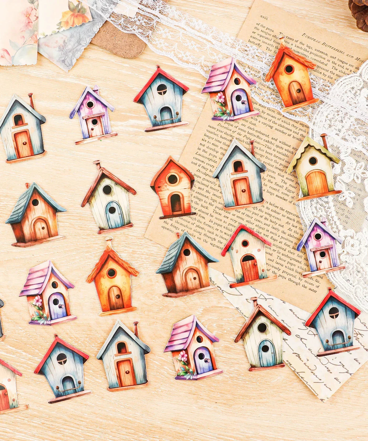 20 Pcs Grabie Exclusive Fairybird House Sticker Set arranged on a wooden surface with paper and lace accents