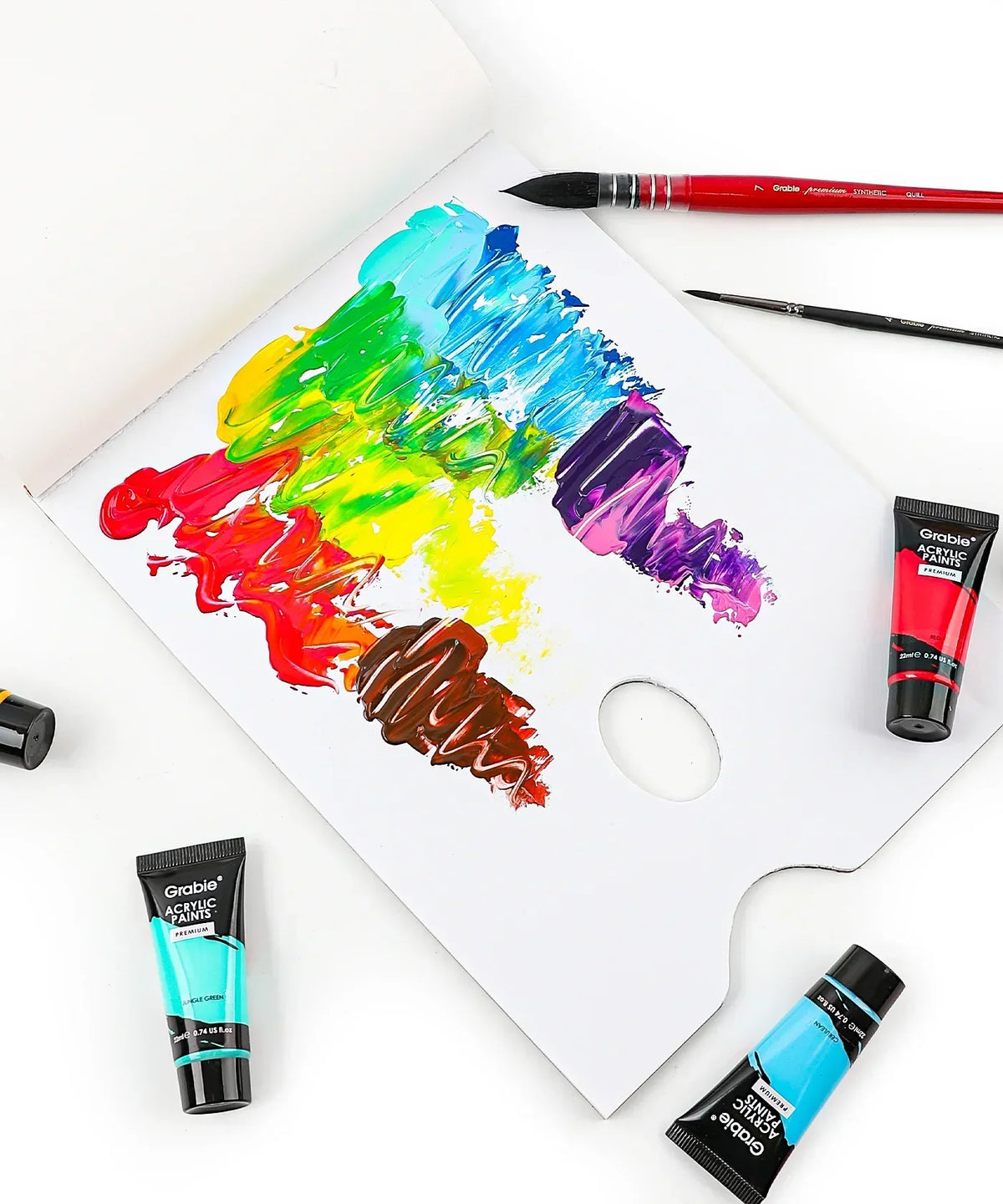 Premium Acrylic Paint Set - 22ml Tubes with vivid rainbow colors on a white palette alongside brushes and tubes of paint
