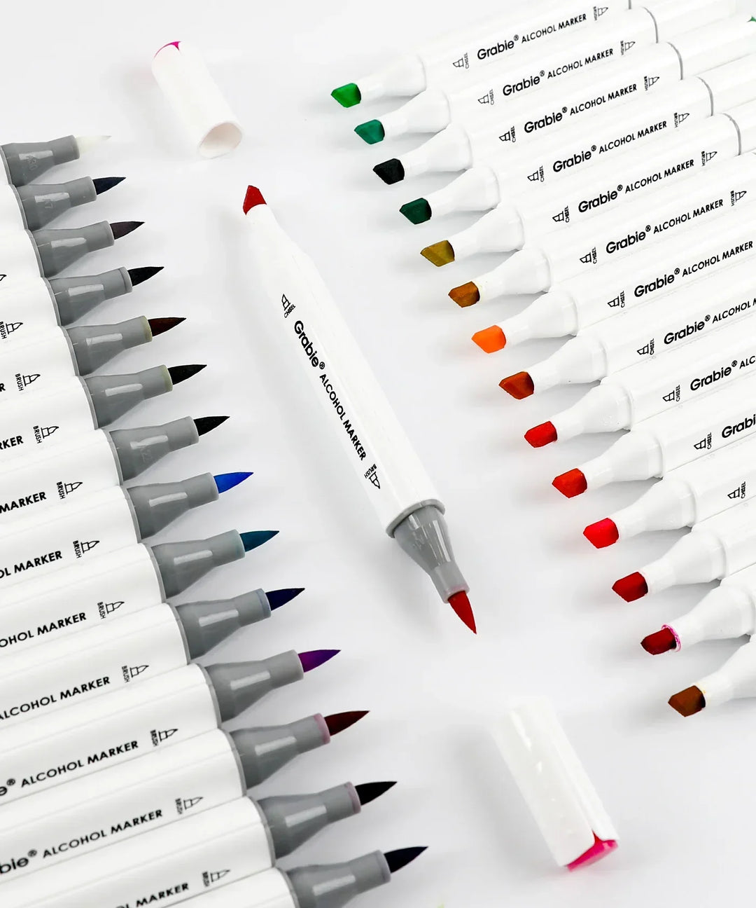 Dual-Tip Alcohol-Based Marker Set Of 48 With Coloring Book showing red marker with colorful art supplies pens on white background