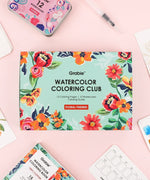 Floral-Themed Watercolor Coloring Club Box with vibrant floral designs and watercolor art supplies on a pastel background