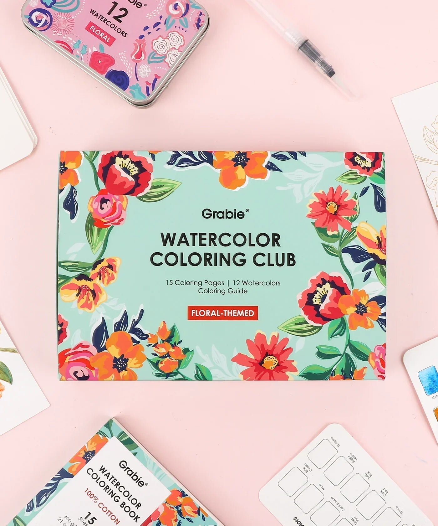 Floral-Themed Watercolor Coloring Club Box with vibrant floral designs and watercolor art supplies on a pastel background