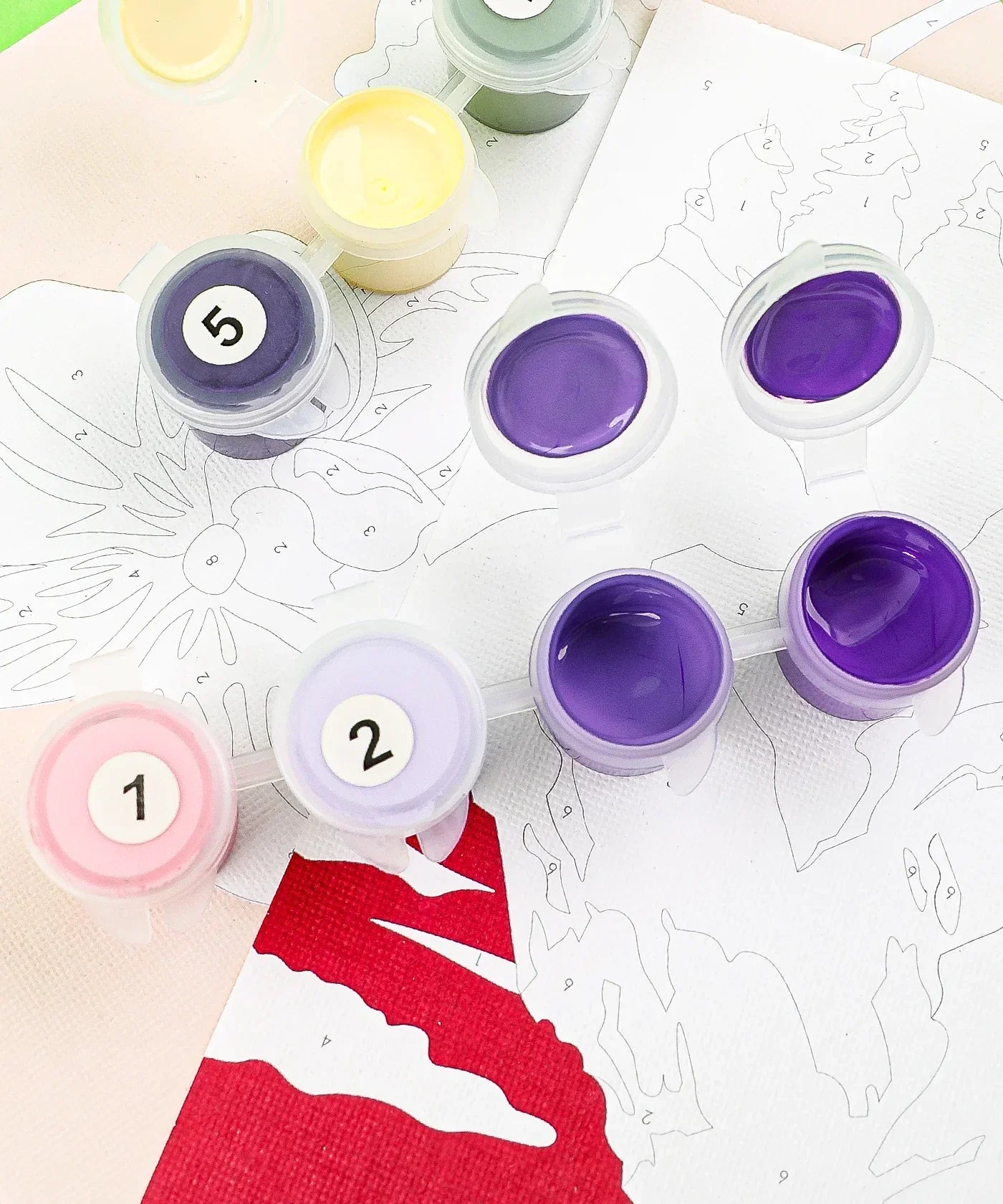 Close-up of numbered paint pots with purple and pink shades on a nature-themed paint-by-number canvas for Paint-by-Number Nature Series Kit - 2 Designs