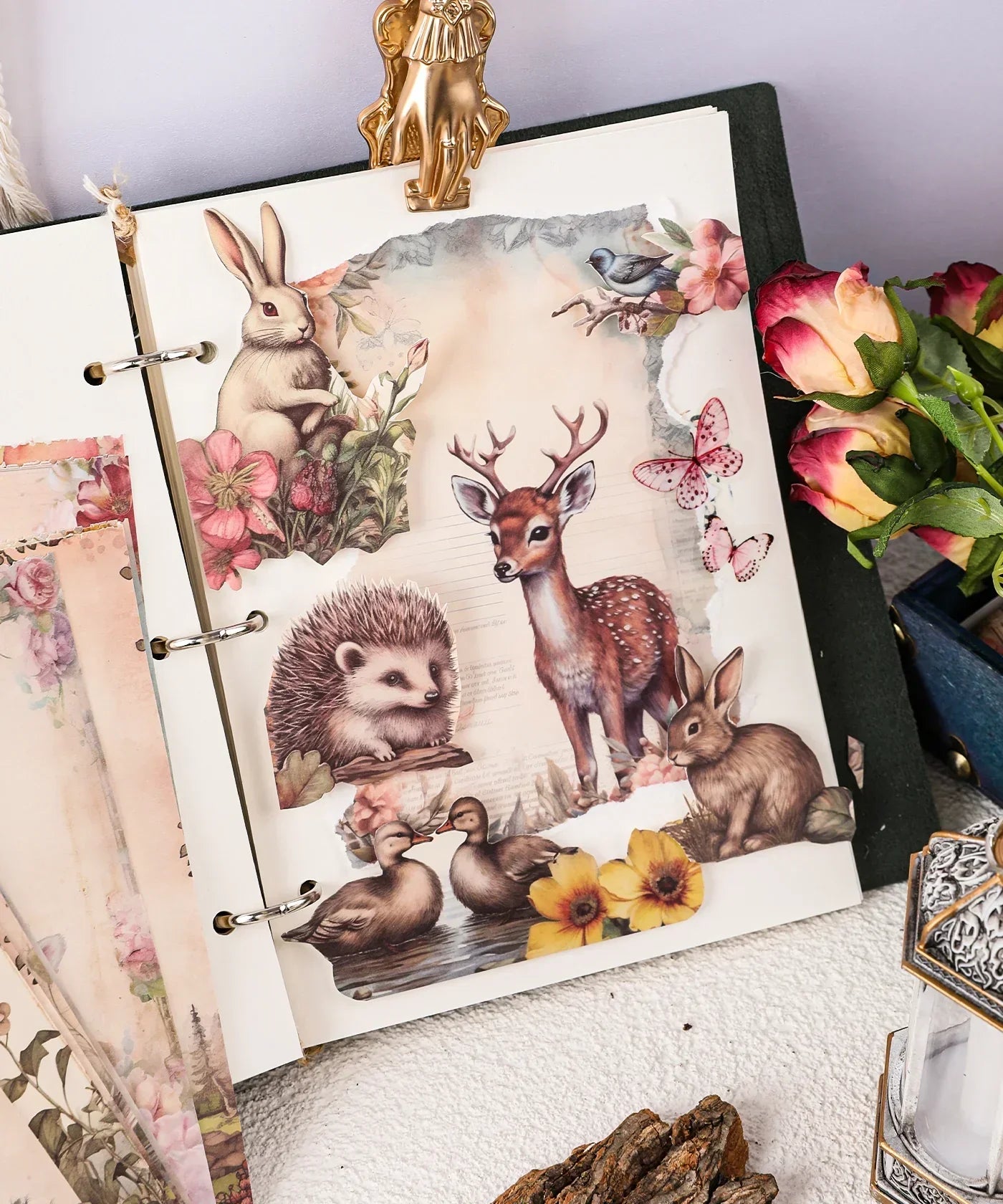Grabie Exclusive Desktop Notepad Jotter open with woodland animal and floral illustrations beside pink and yellow roses