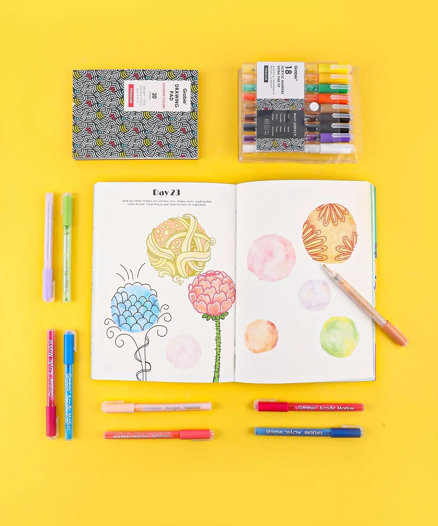 Let Your Feelings Flow Grabie Art Club Box with markers and open sketchbook showing colorful floral and abstract drawings