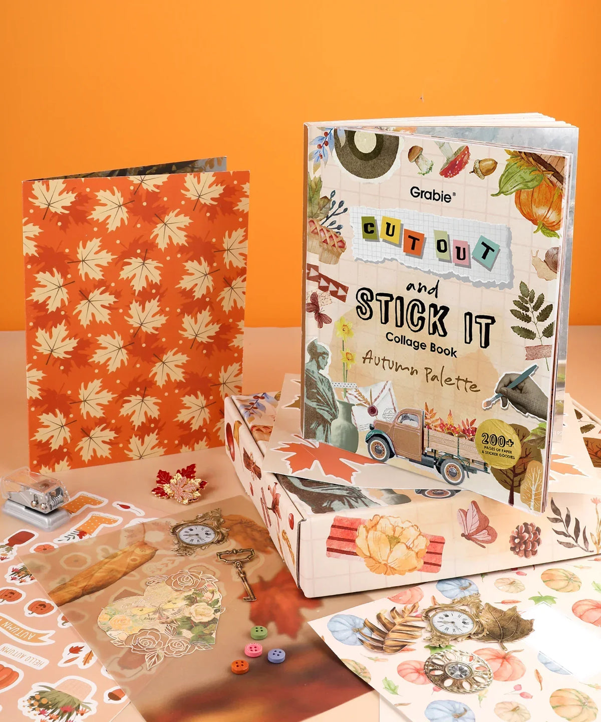 200+ Pages Autumn Palette Collage Activity Book For Faire with stickers, scrapbook pages, and autumn leaf designs on orange background