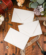 Grabie Exclusive 6 Pack Postcards With 6 Matching Envelopes arranged on wood with flowers, lace, and vintage decor accessories.
