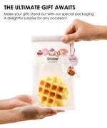 Hand holding Feel-Good Stress Relief Foam Squishy - Waffle Sandwich in clear packaging with bakery-themed design
