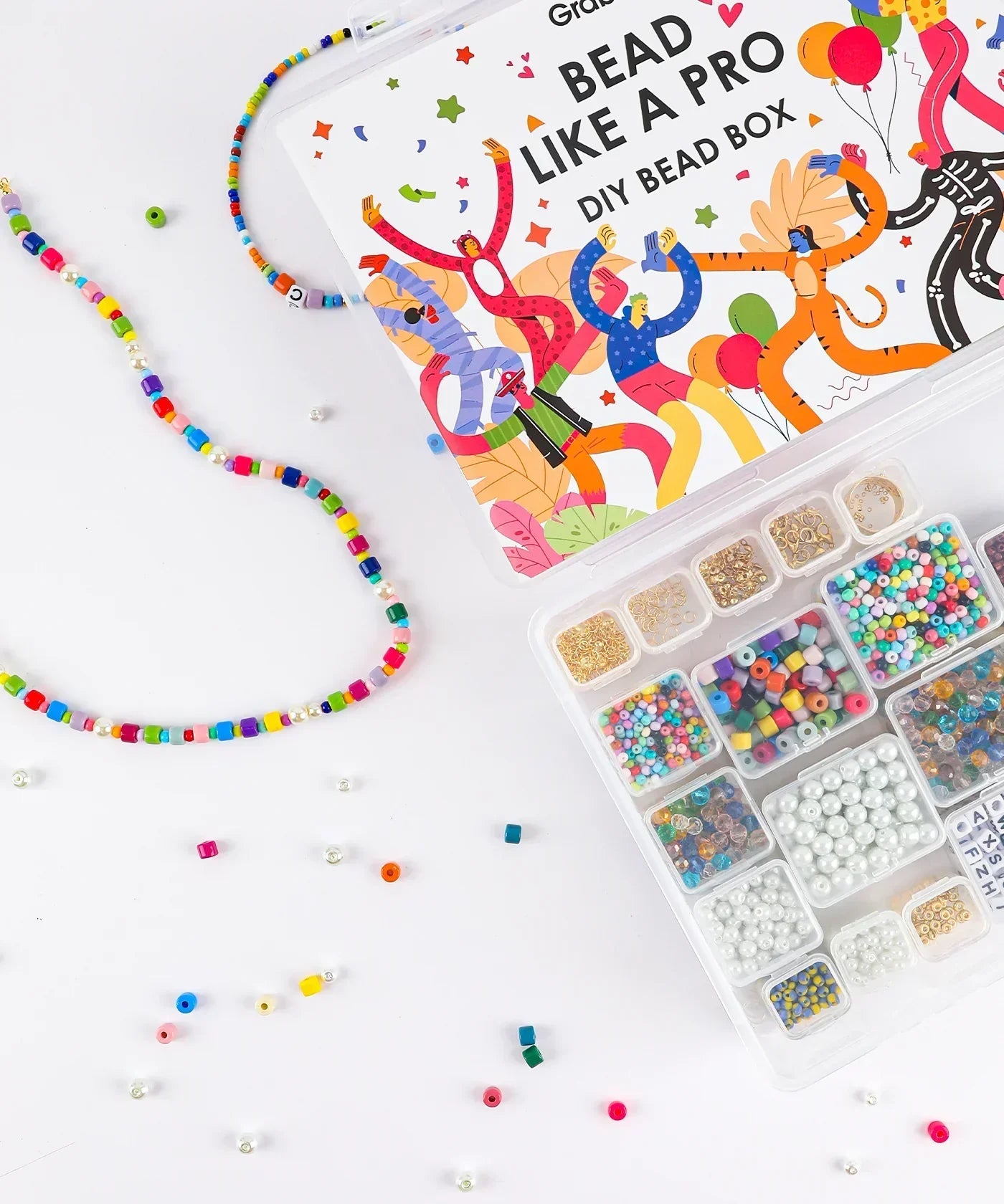 Grabie Bead Box with colorful beads and strings for DIY craft projects and creative beadwork supplies.