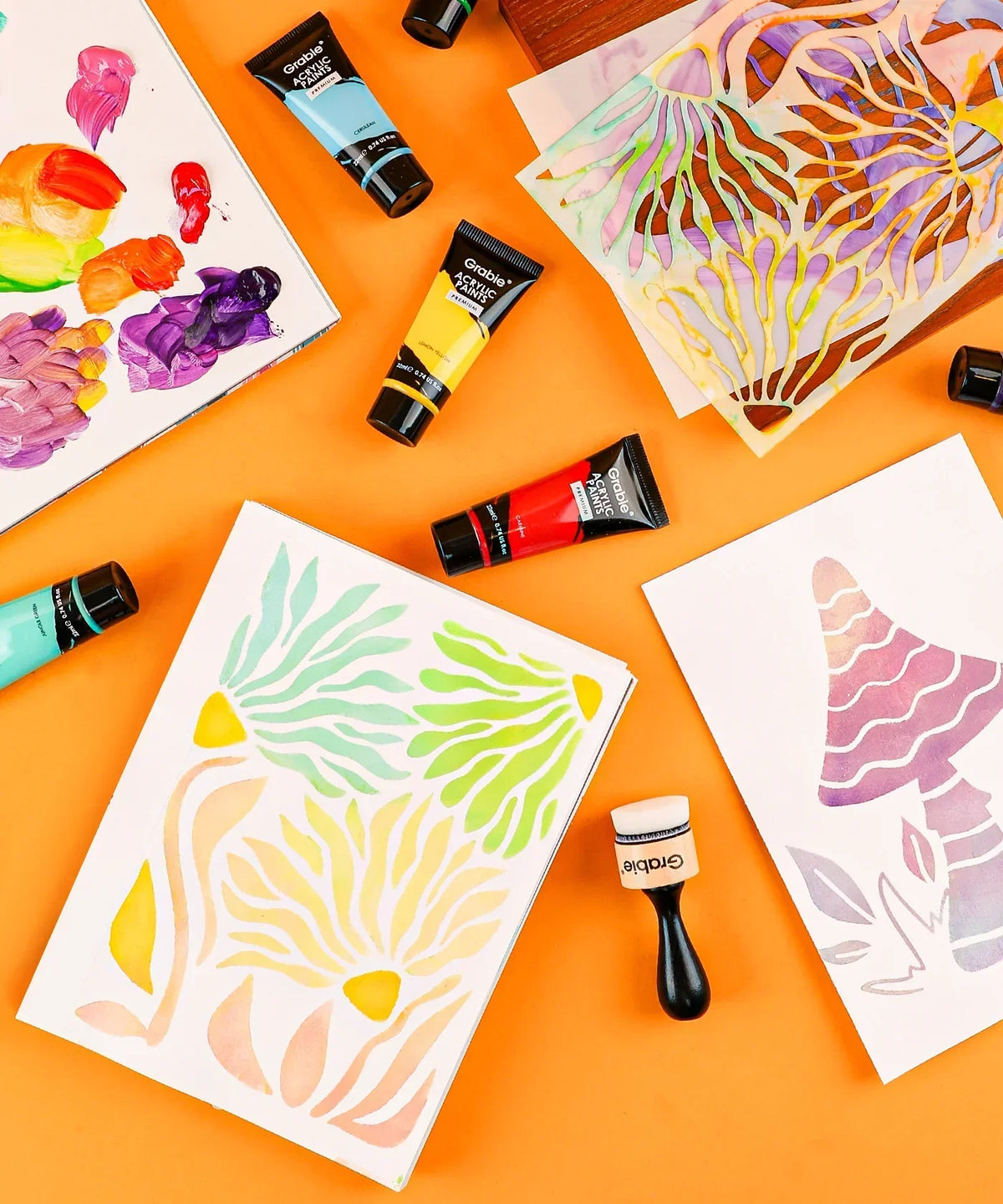 Premium Acrylic Paint Set - 22ml Tubes with colorful floral and mushroom paintings on an orange background