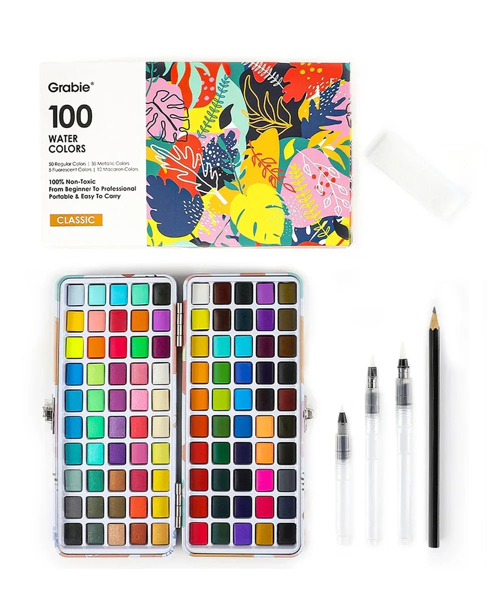 Watercolor Travel Set of 100 With Brush showing colorful paint pans, brush pens, and pencil for art supplies and watercolor painting.