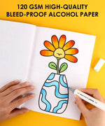 Hand coloring a flower vase illustration in a book using Dual Tone Brush Tip Acrylic Paint Marker Set With Coloring Book on yellow background
